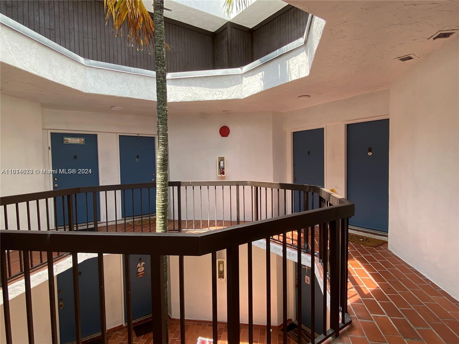 a view of staircase with railing and wooden floor