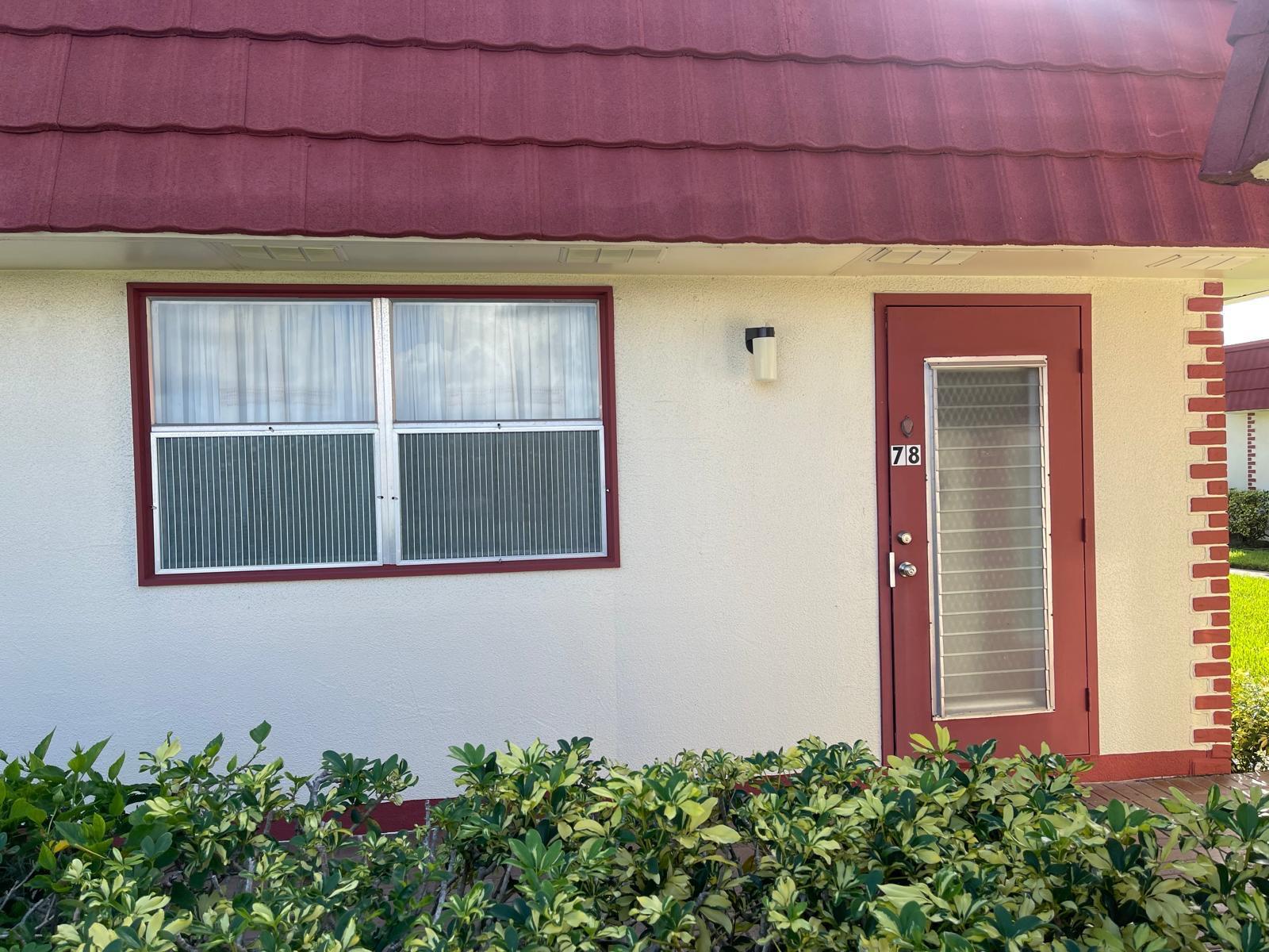 a front view of a house with a garage