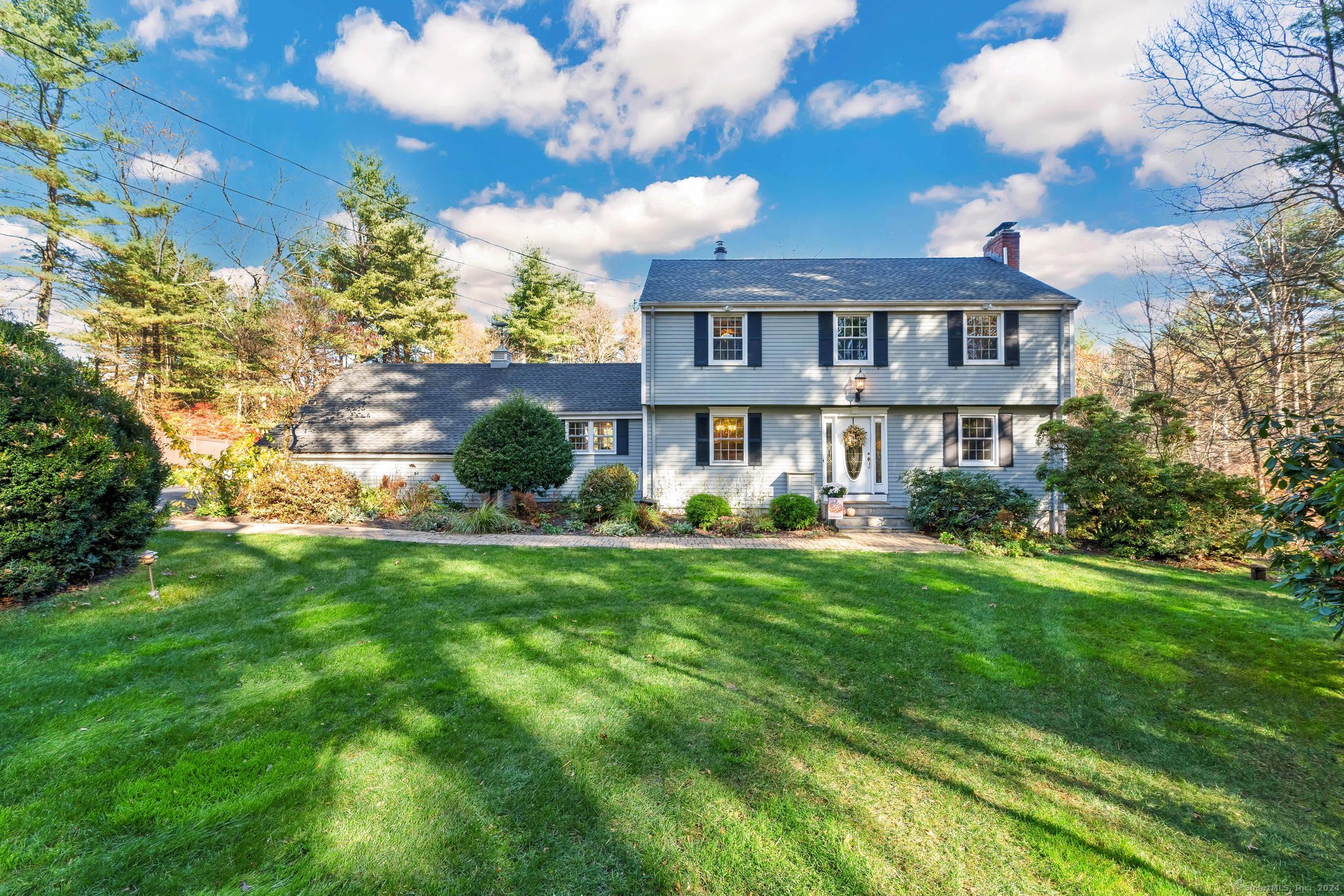 a front view of a house with a yard