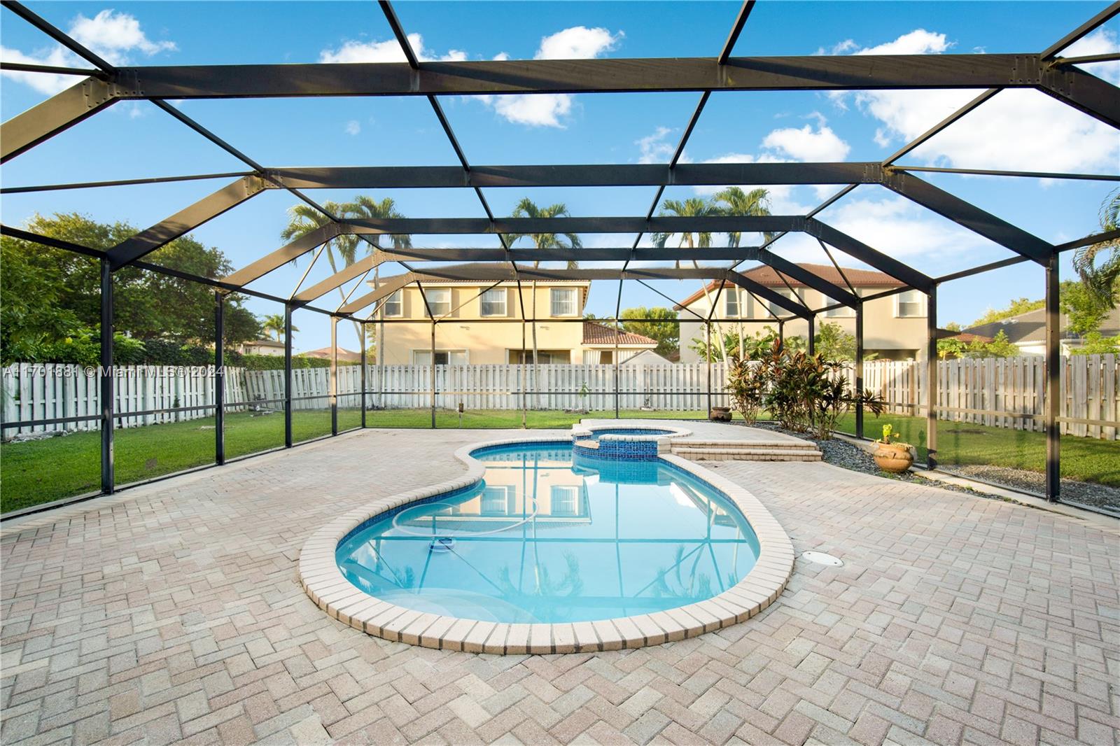 a view of a swimming pool with a patio