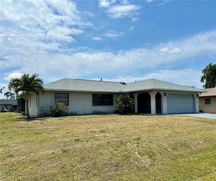 a view of a house with a yard