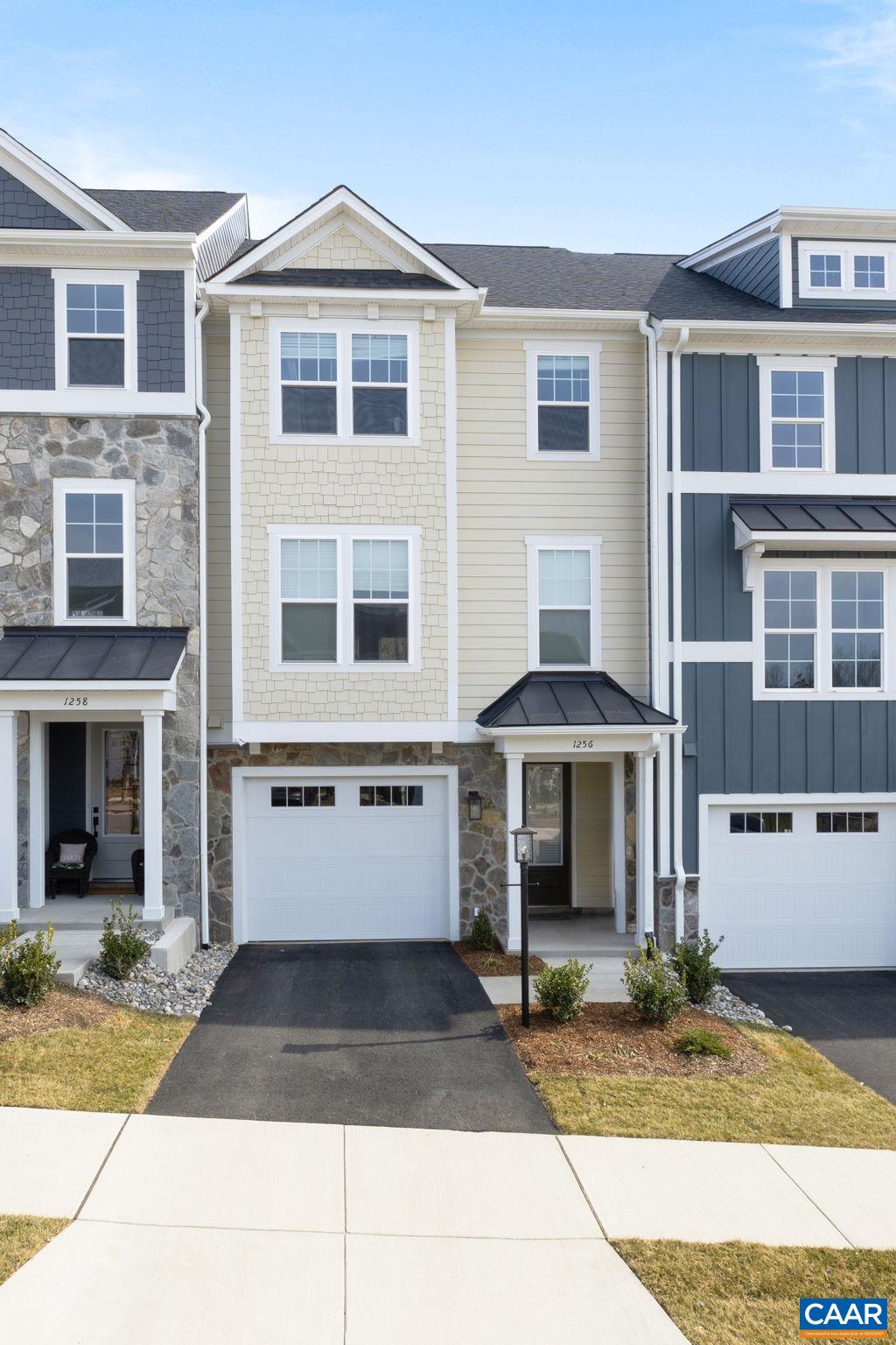 a front view of a house with yard