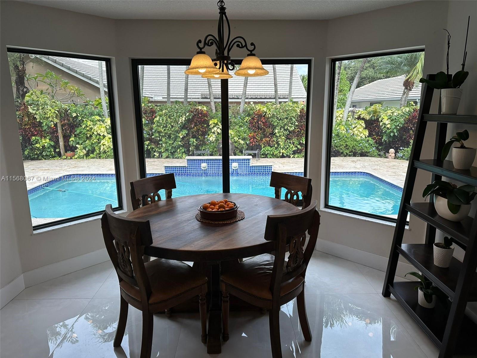 a dining room with furniture window and outside view