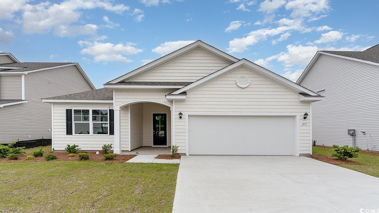 View of front of property with a garage and a fron