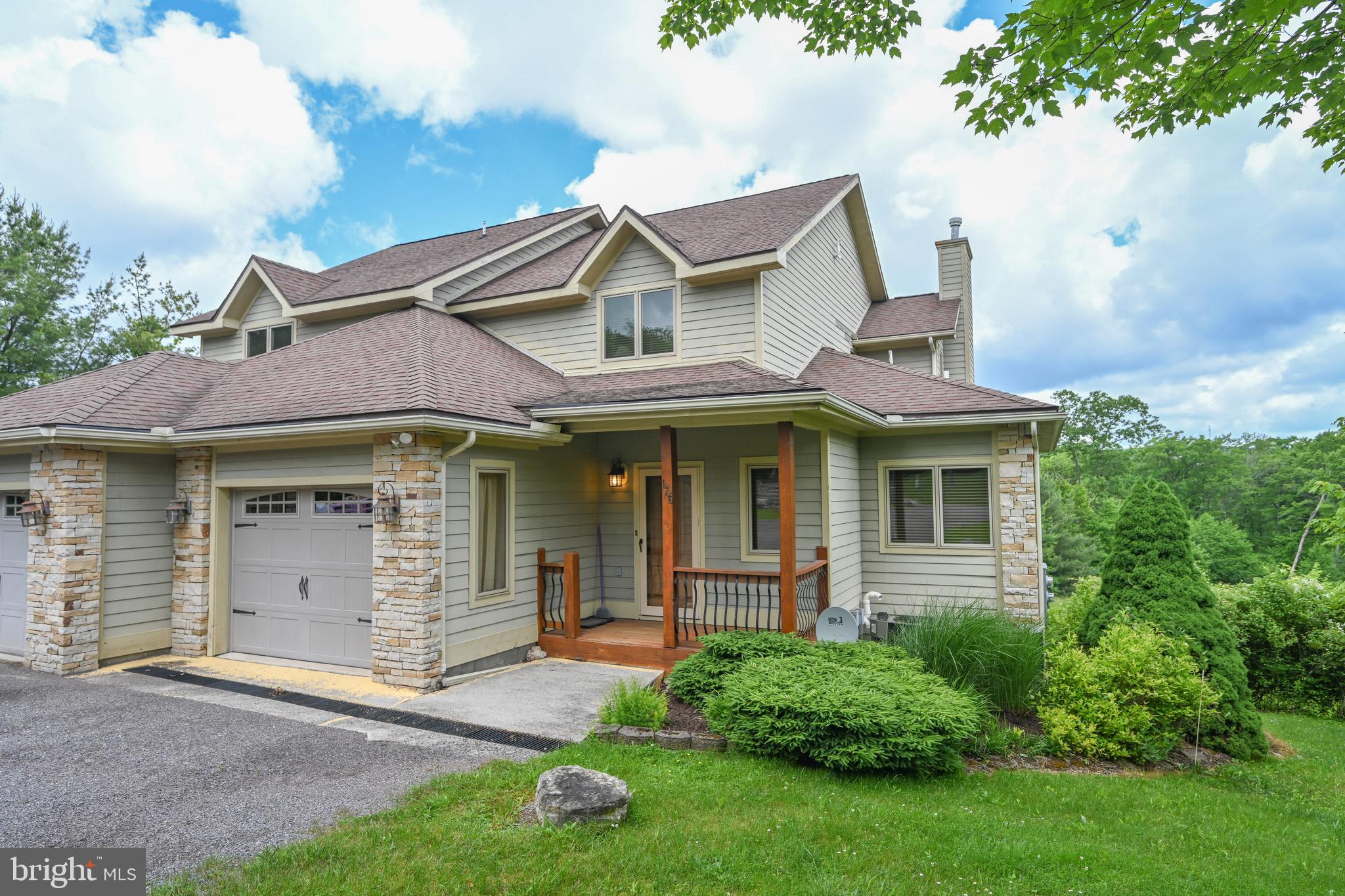 front view of a house with a yard