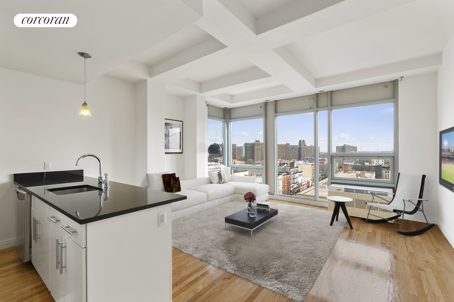 a very nice looking living room with a large window