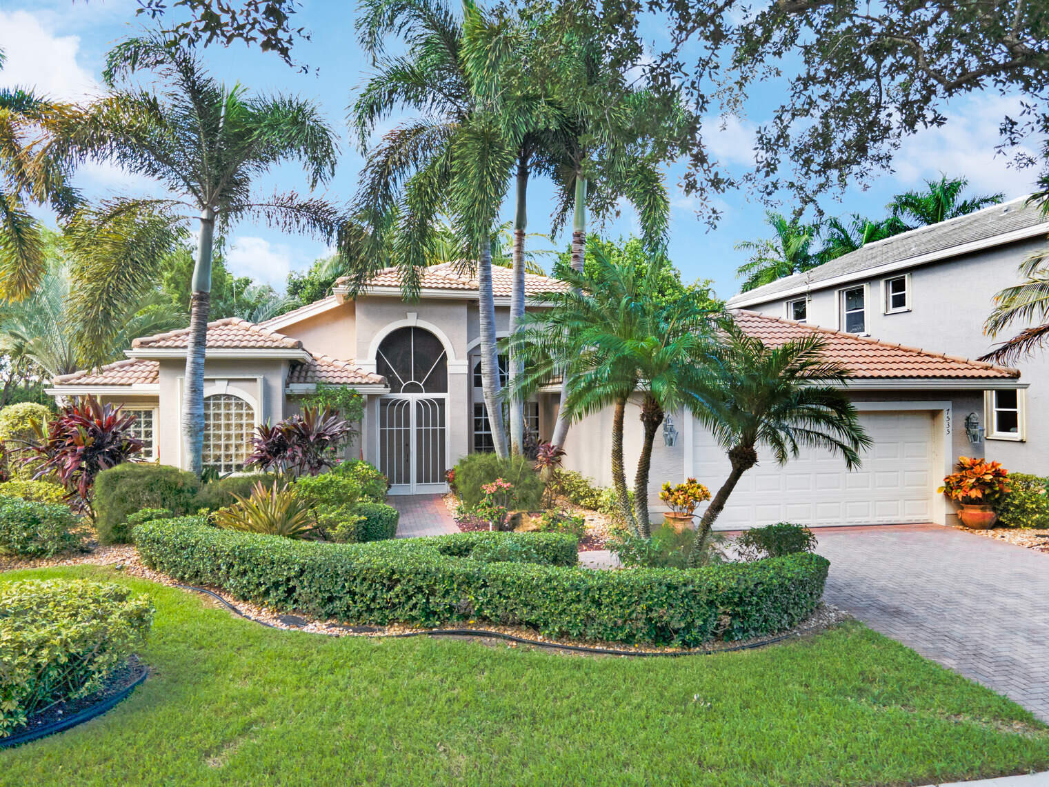 a front view of a house with garden