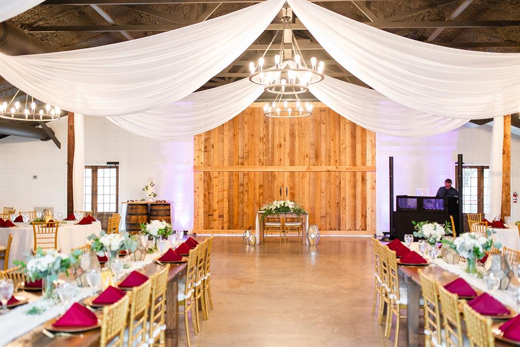 a living room filled with furniture and a chandelier