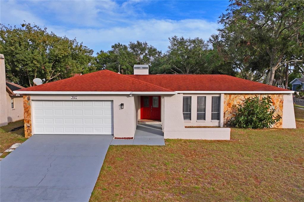 front view of a house with a yard