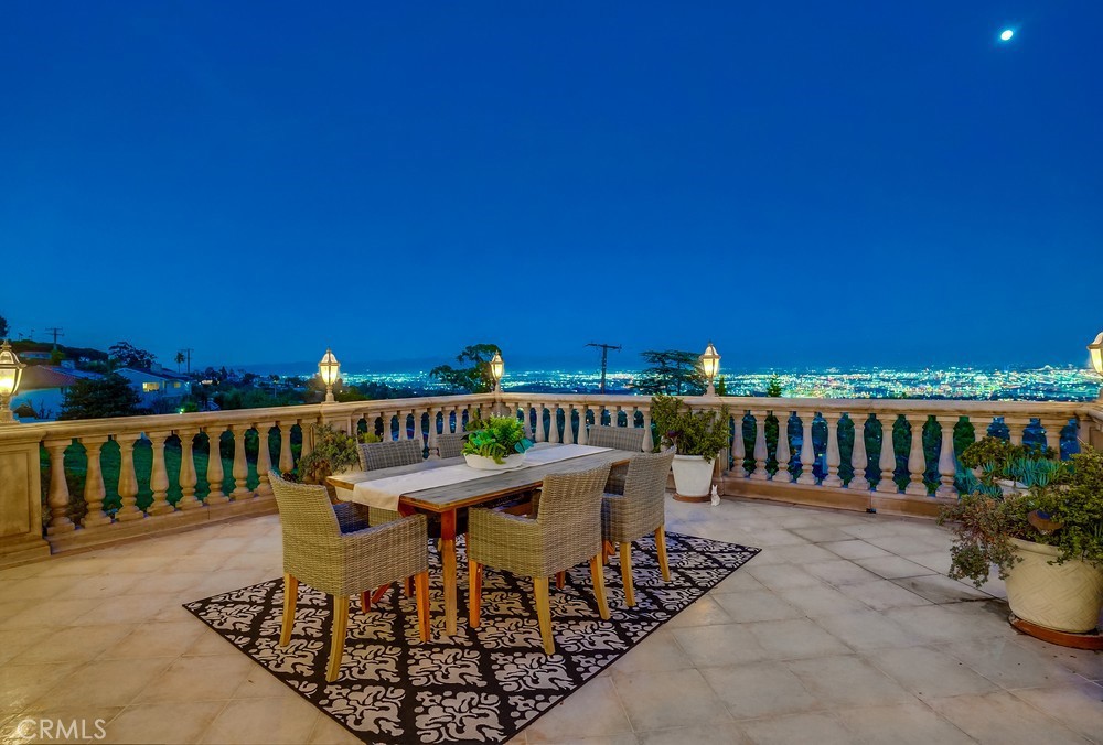 a view of a balcony with furniture