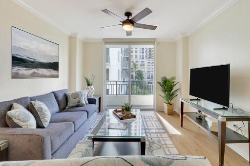 a living room with furniture and a flat screen tv