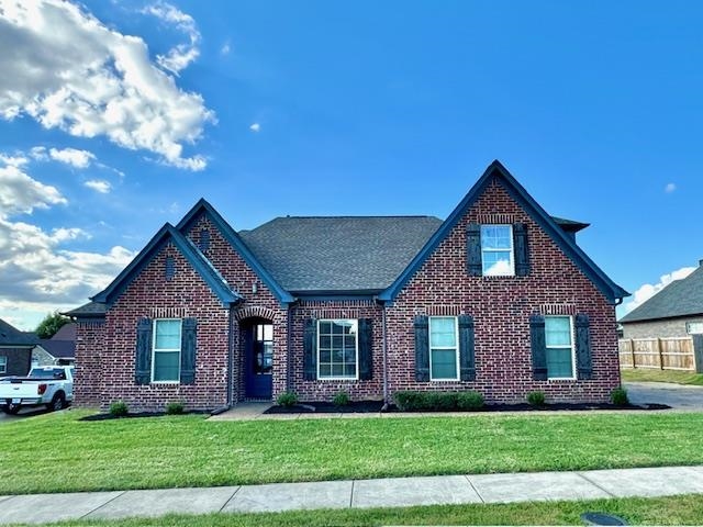 View of front of house featuring a front lawn