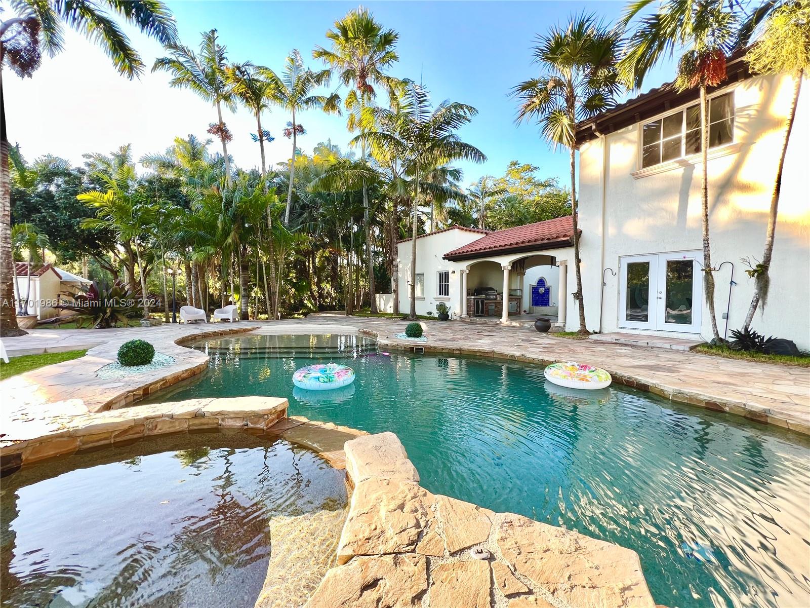 a view of swimming pool with a yard