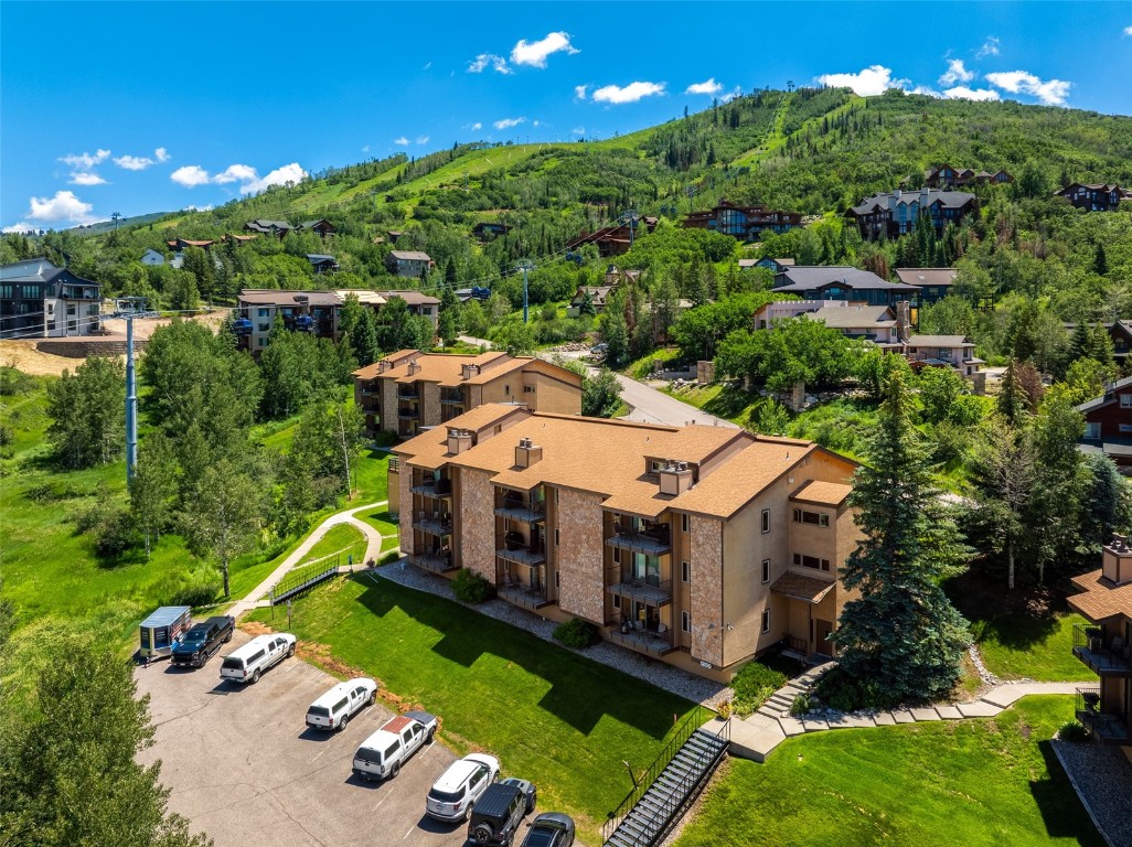 an aerial view of a house with a big yard