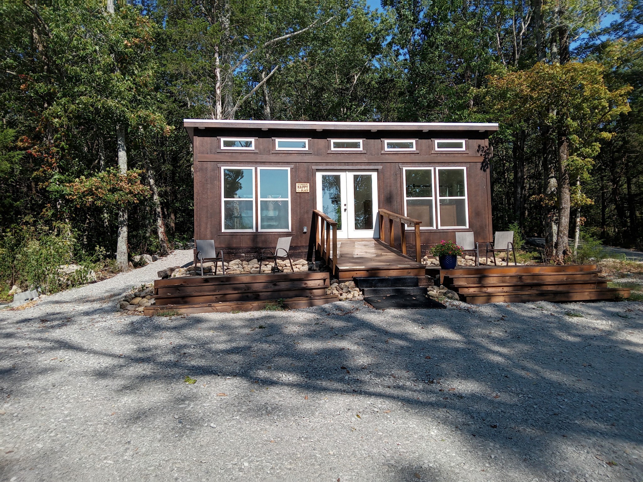 a view of a house with a yard and sitting area