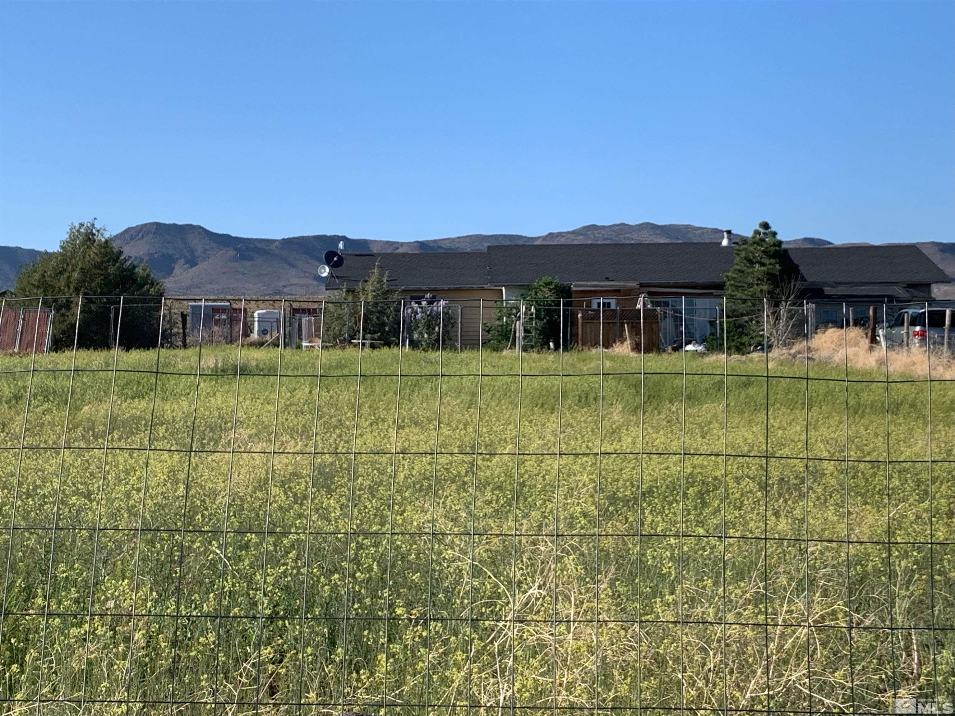 a view of a large building next to a yard