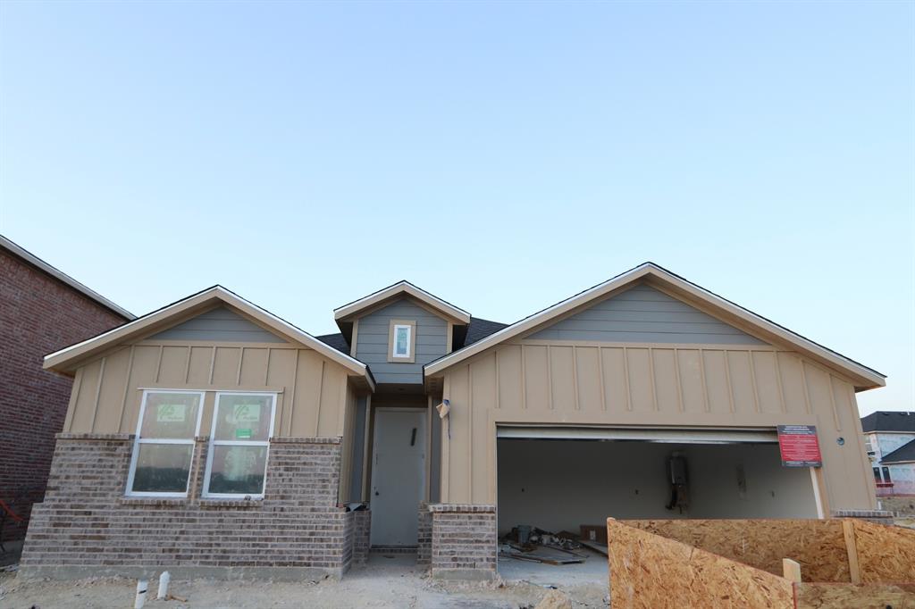 a front view of a house with garage