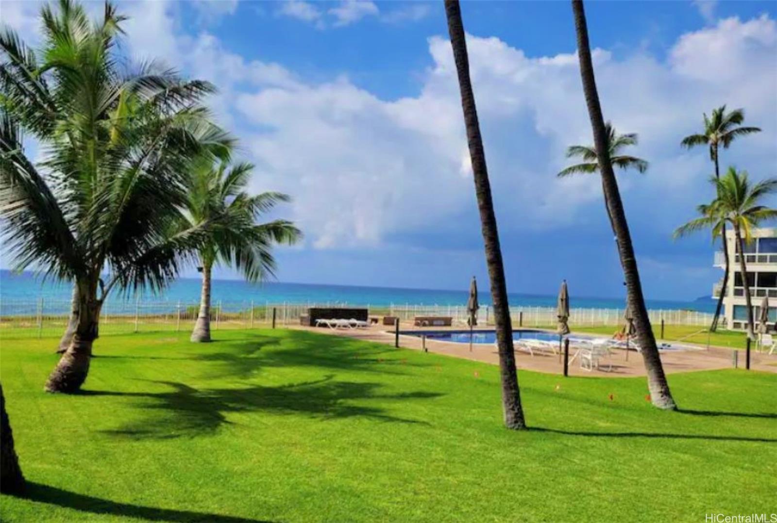 a view of a backyard with couches