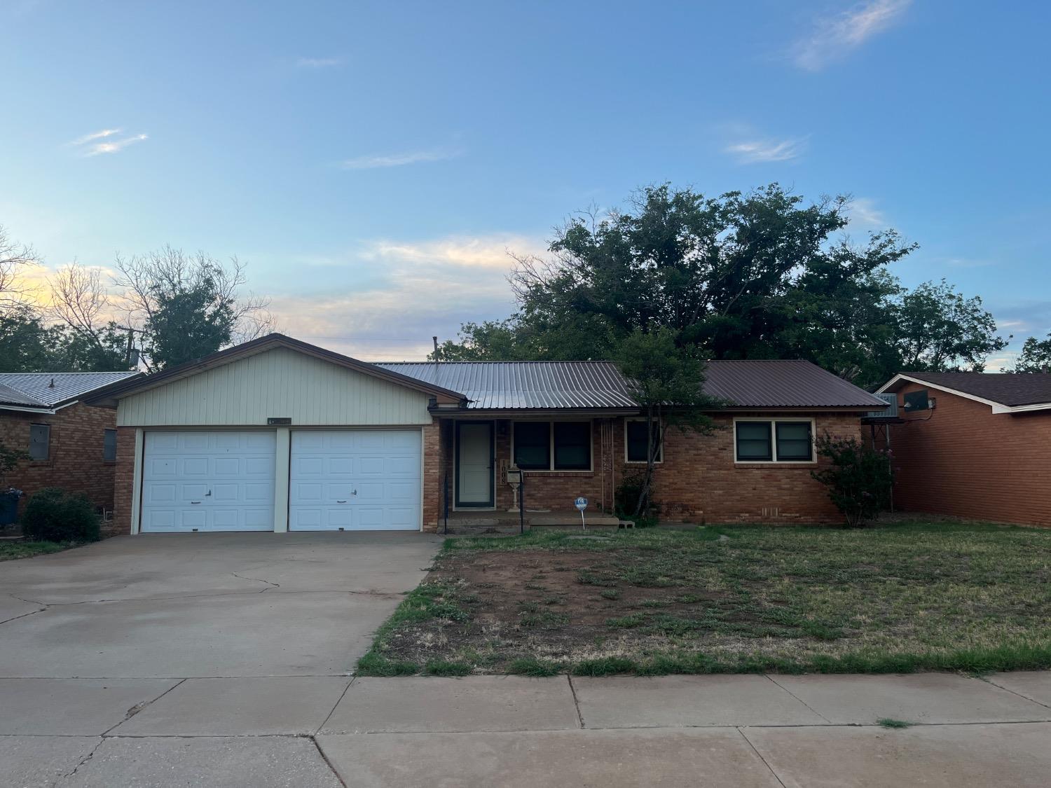 front view of house with a yard