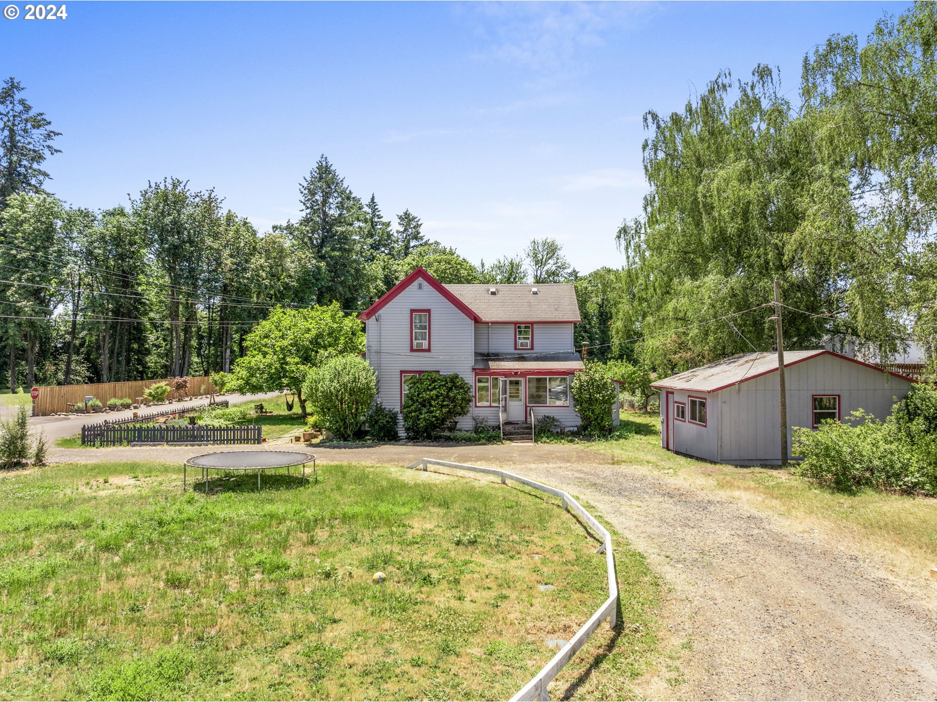 a view of a house with swimming pool and a yard