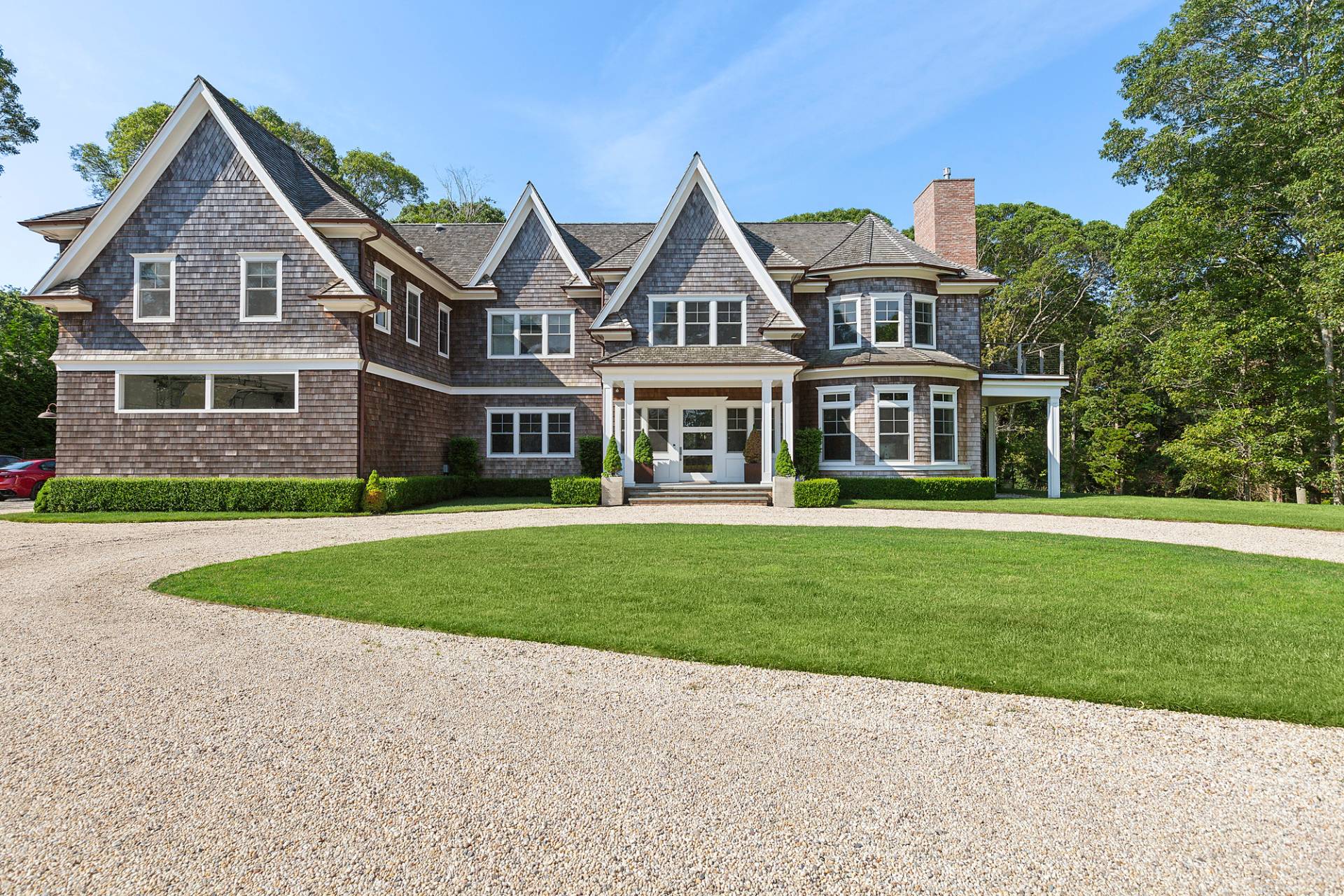 a front view of a house with a garden