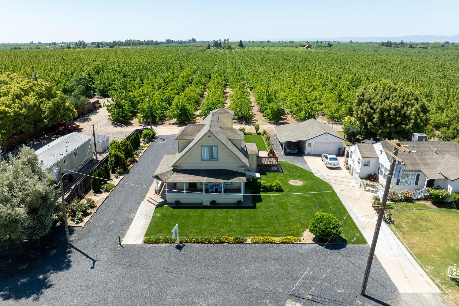 a aerial view of a house with swimming pool and garden