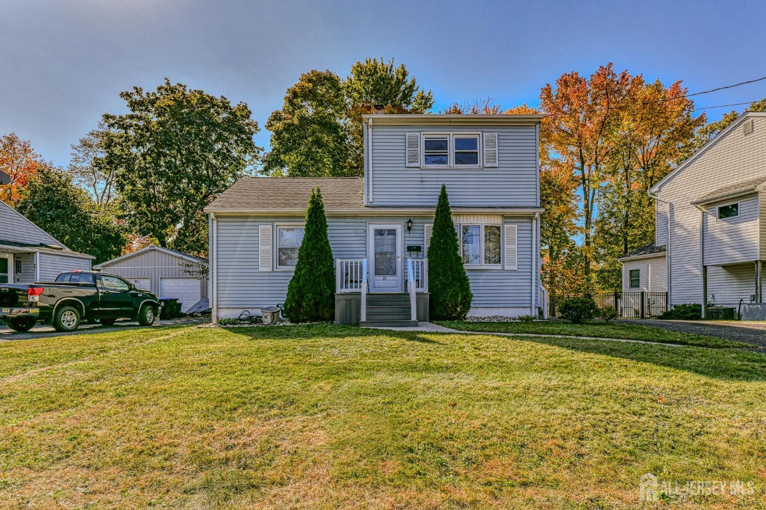 a view of a house with a yard and garage