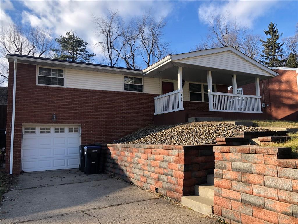 front view of a house with a bench