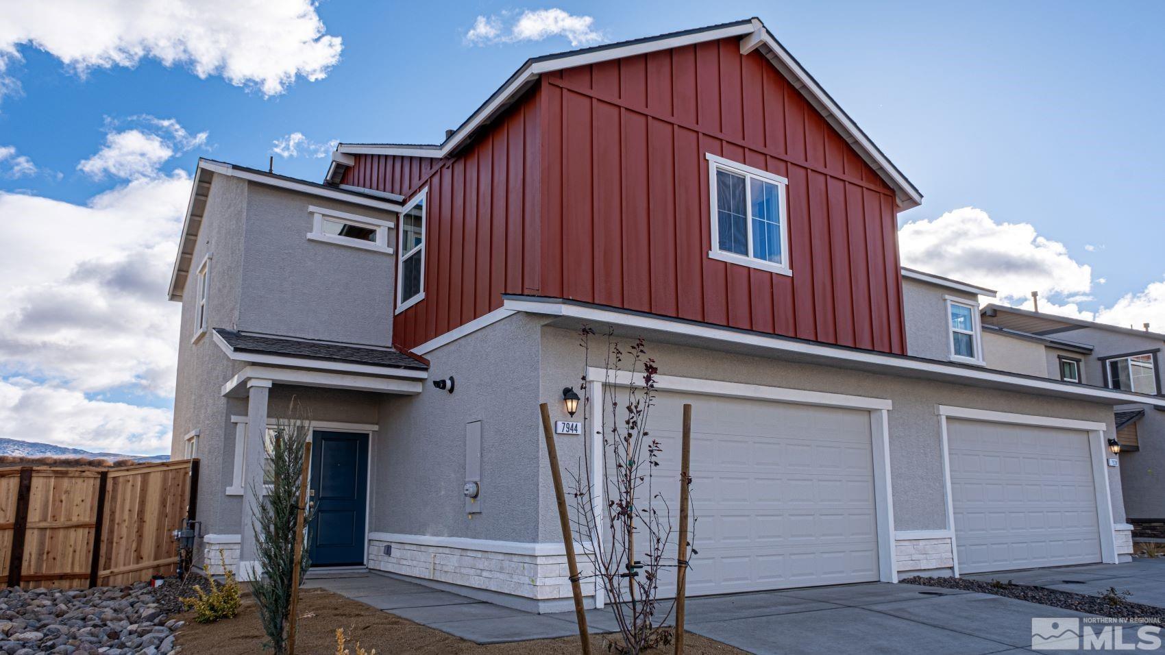 a front view of a house with a garage