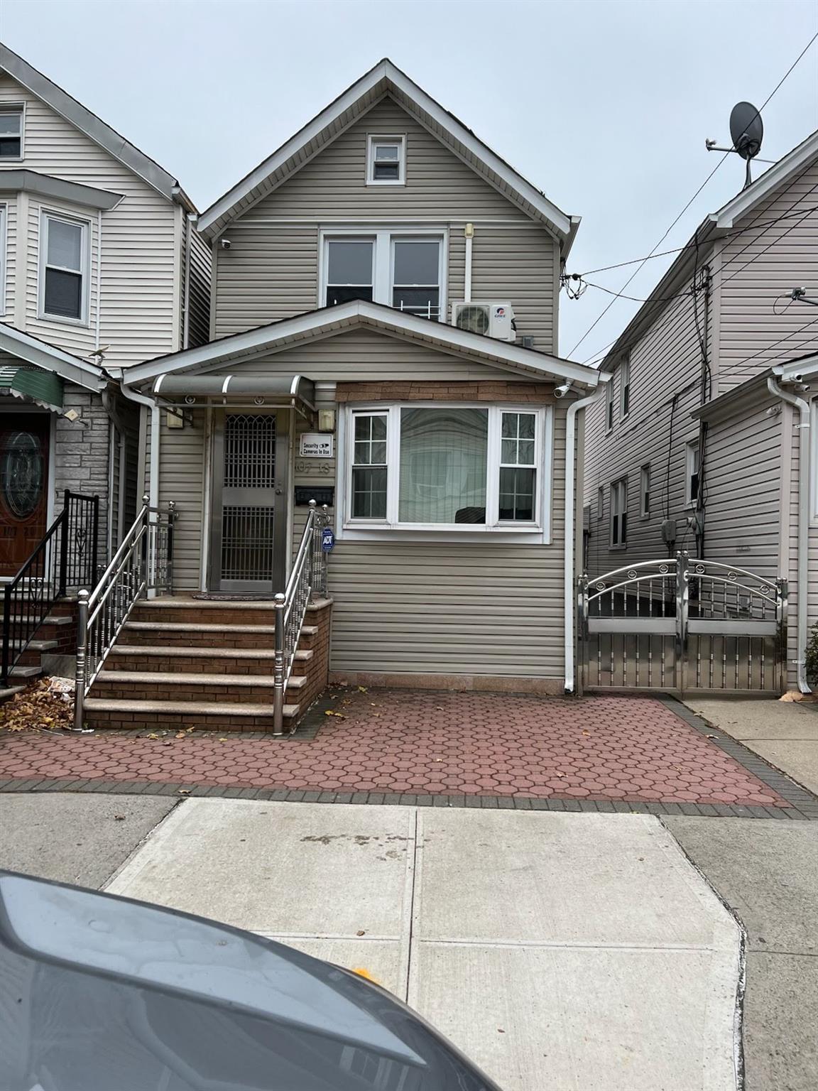 a front view of a house with stairs