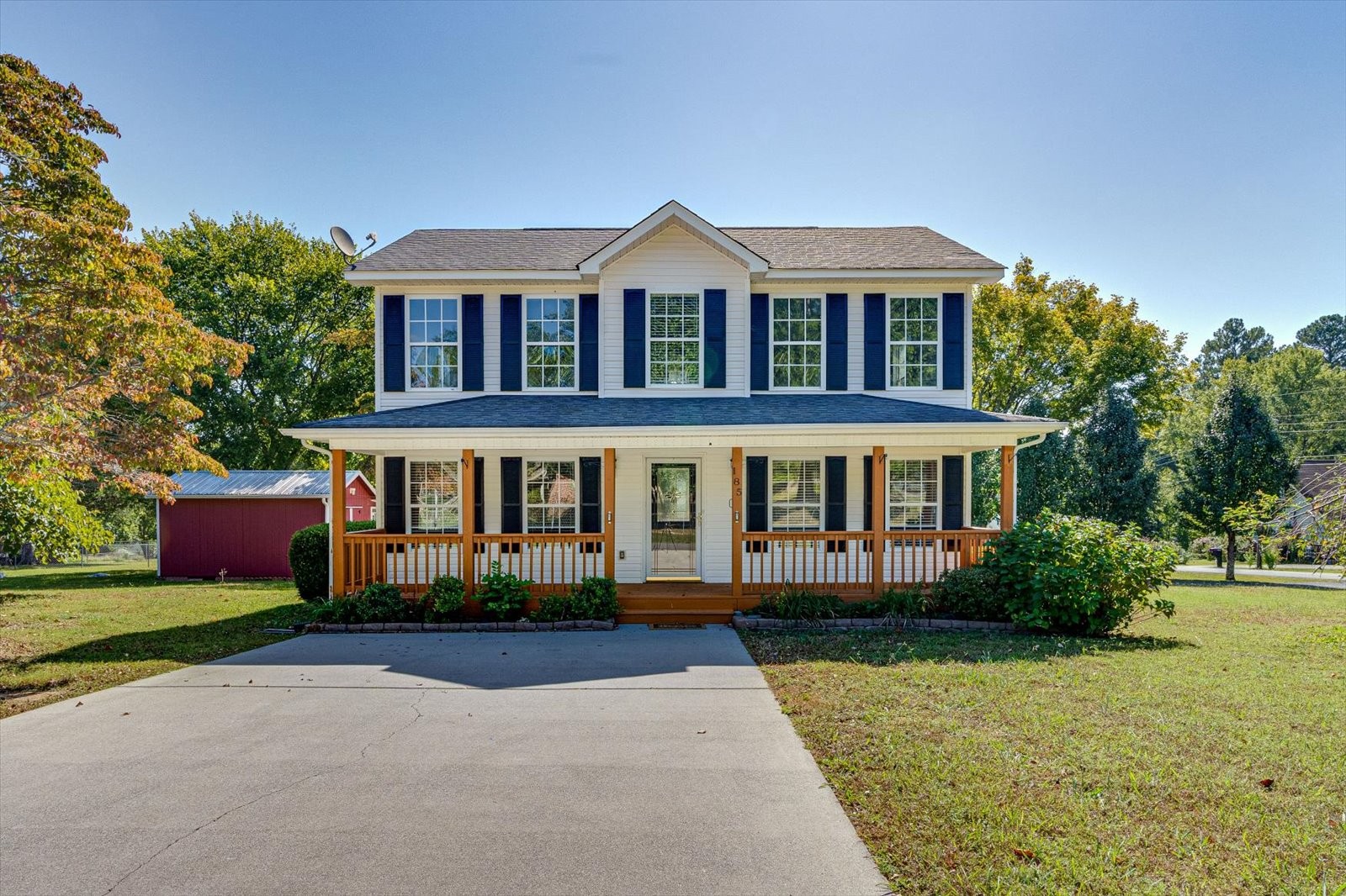 front view of a house with a yard