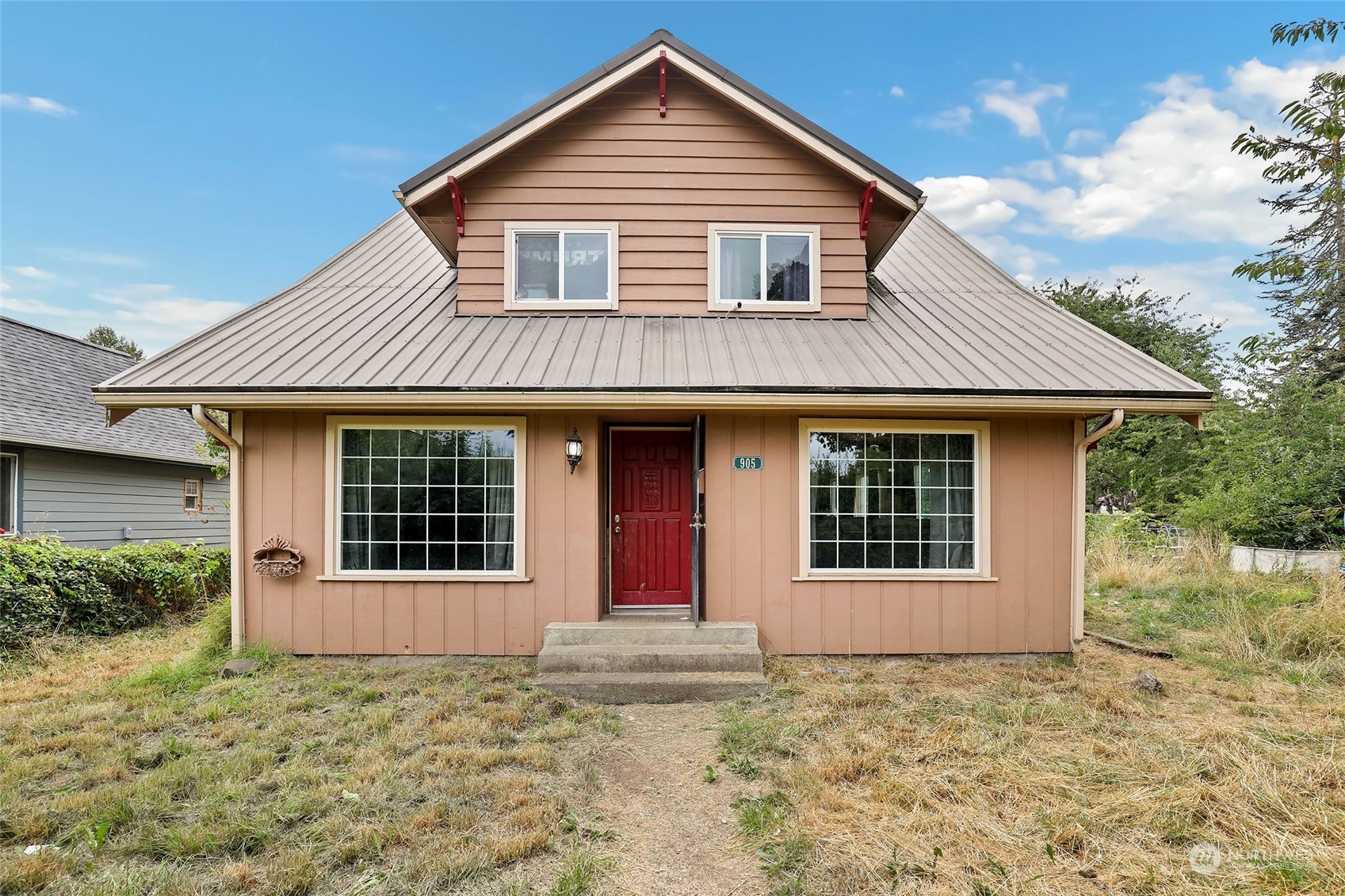 a front view of a house with a yard