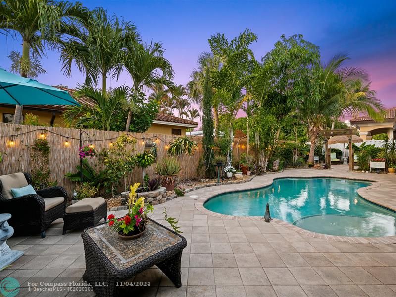 a view of a swimming pool with patio