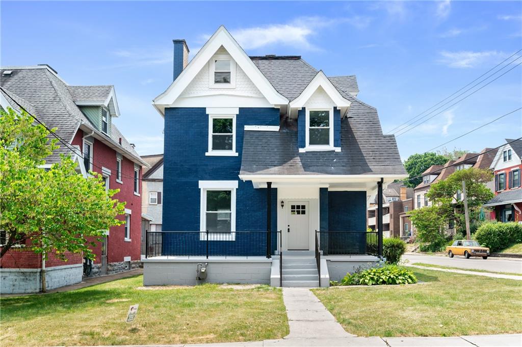 front view of a house with a yard