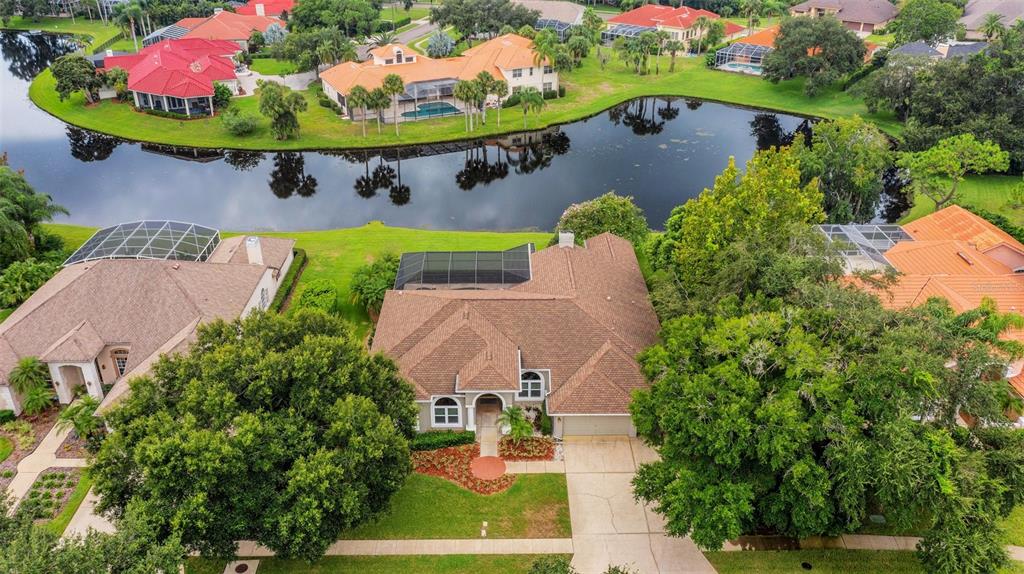 an aerial view of a house with outdoor space