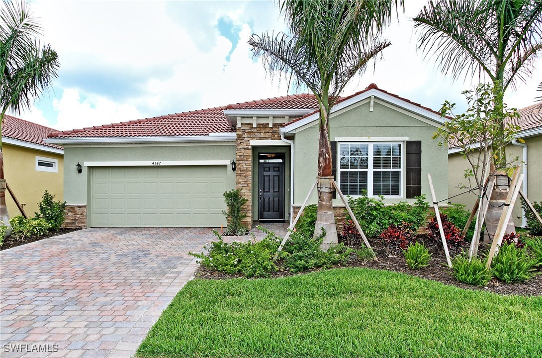 front view of a house with a yard