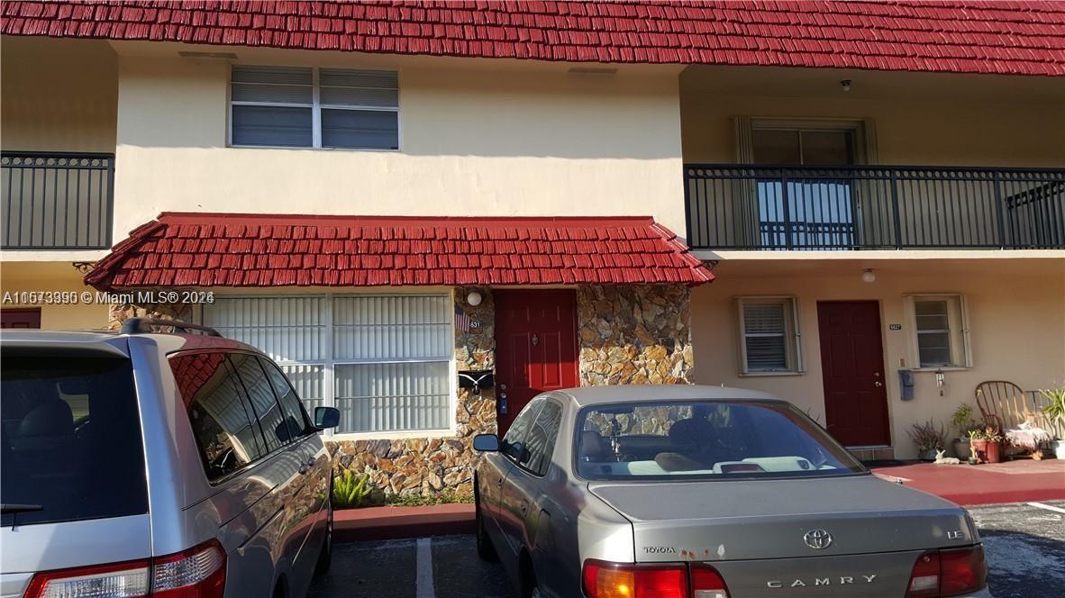 a front view of house with outdoor seating