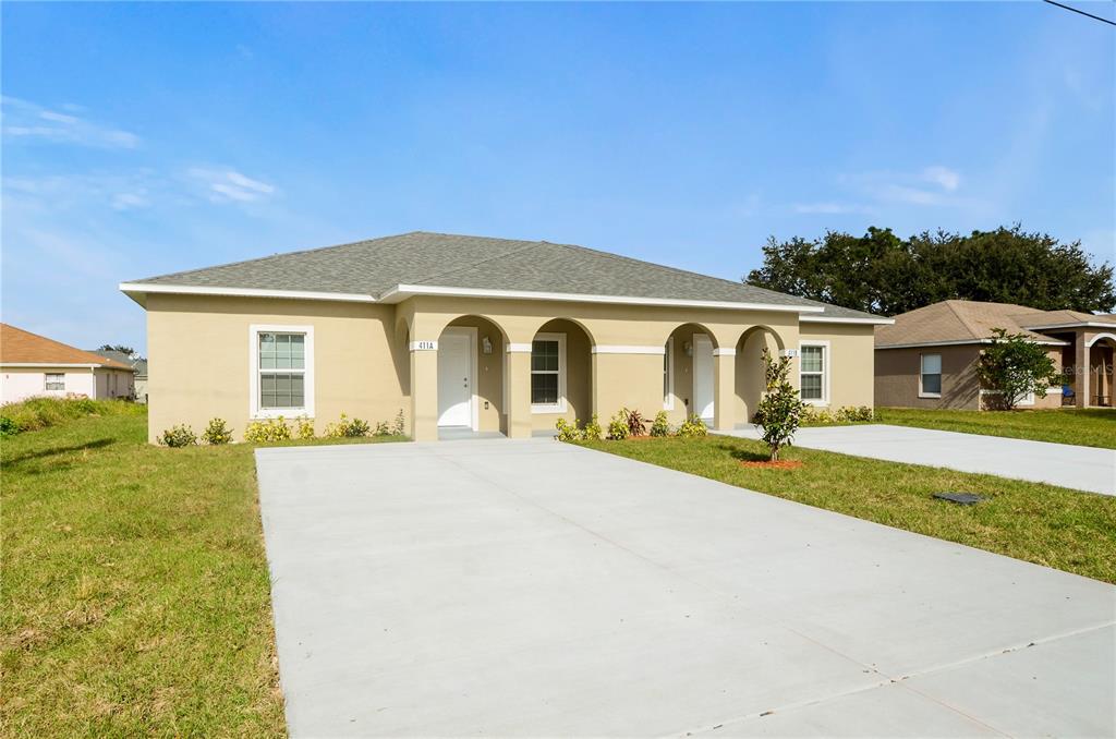 a front view of a house with a yard