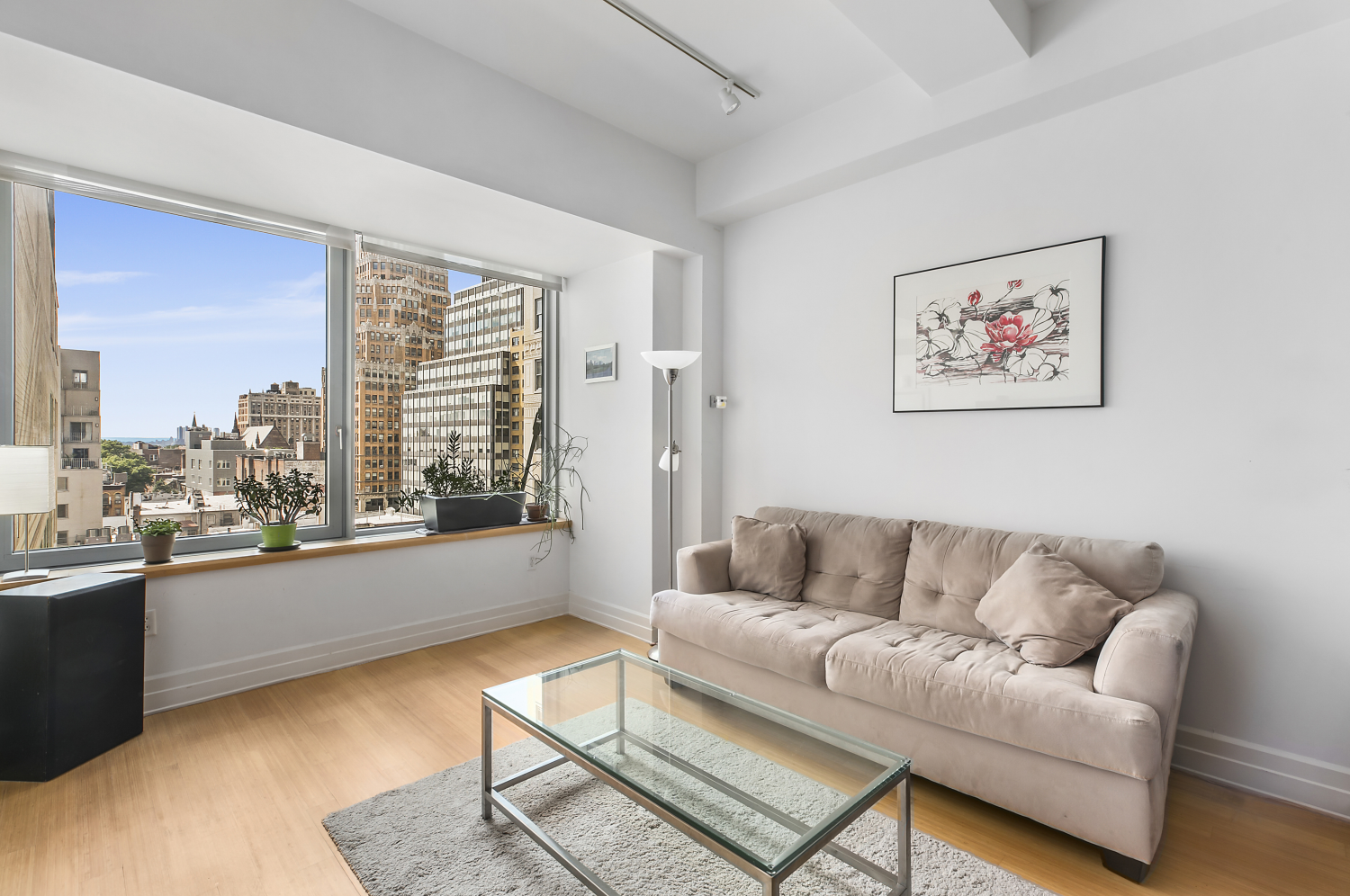 a living room with furniture and a large window