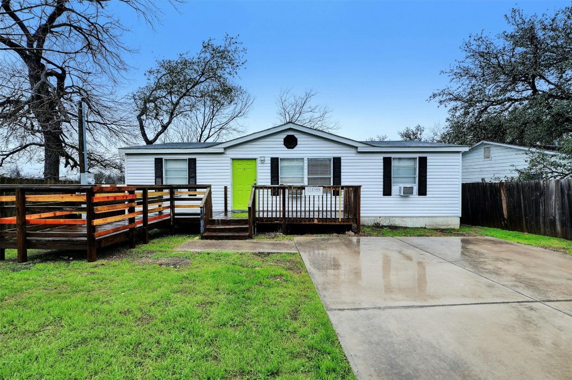 a view of a house with a backyard and a patio