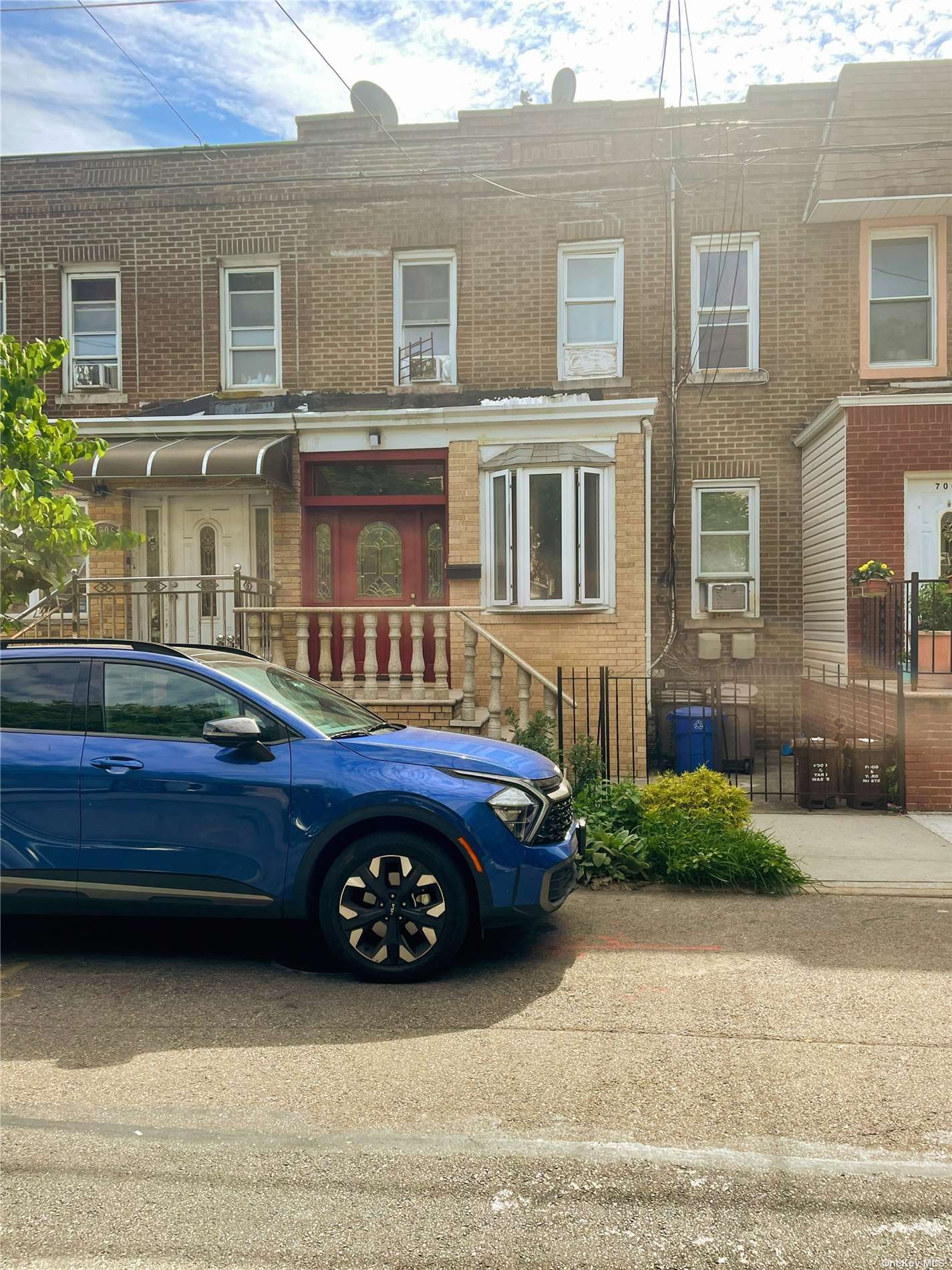 a front view of a house with parking space