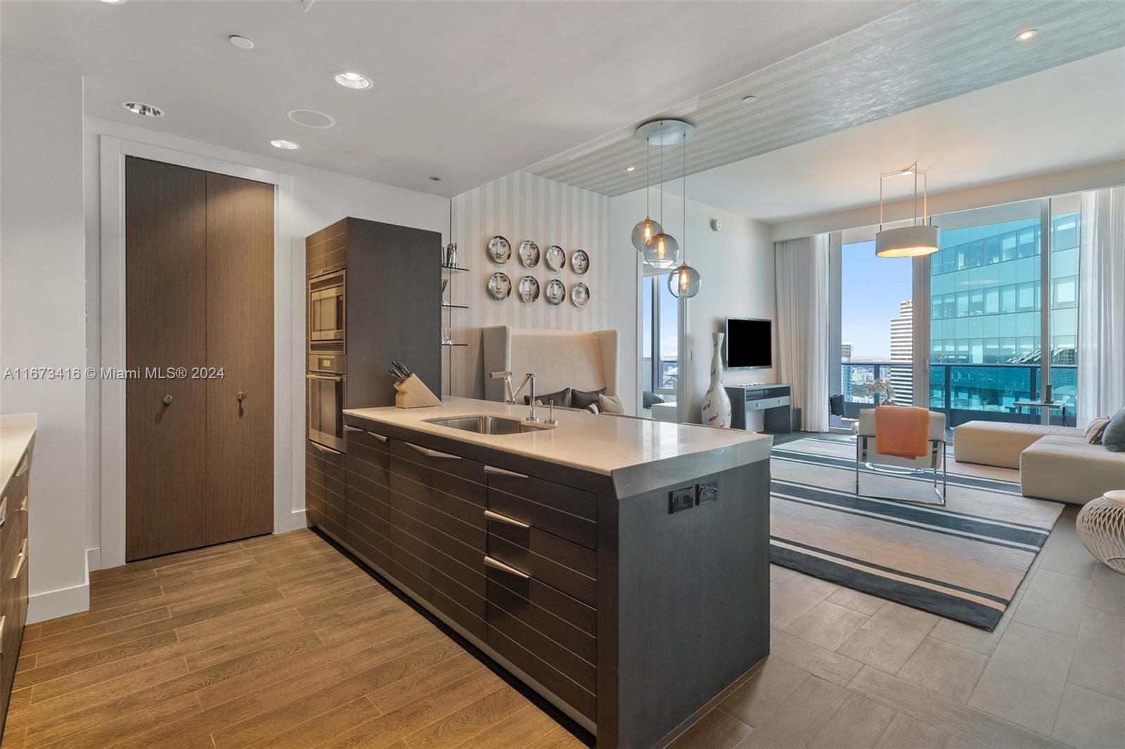 a kitchen with stainless steel appliances granite countertop a stove and a refrigerator