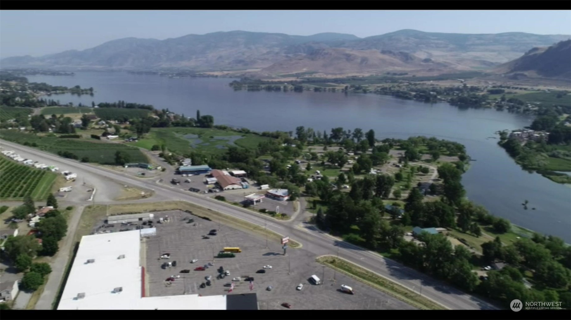 an aerial view of lake and mountain