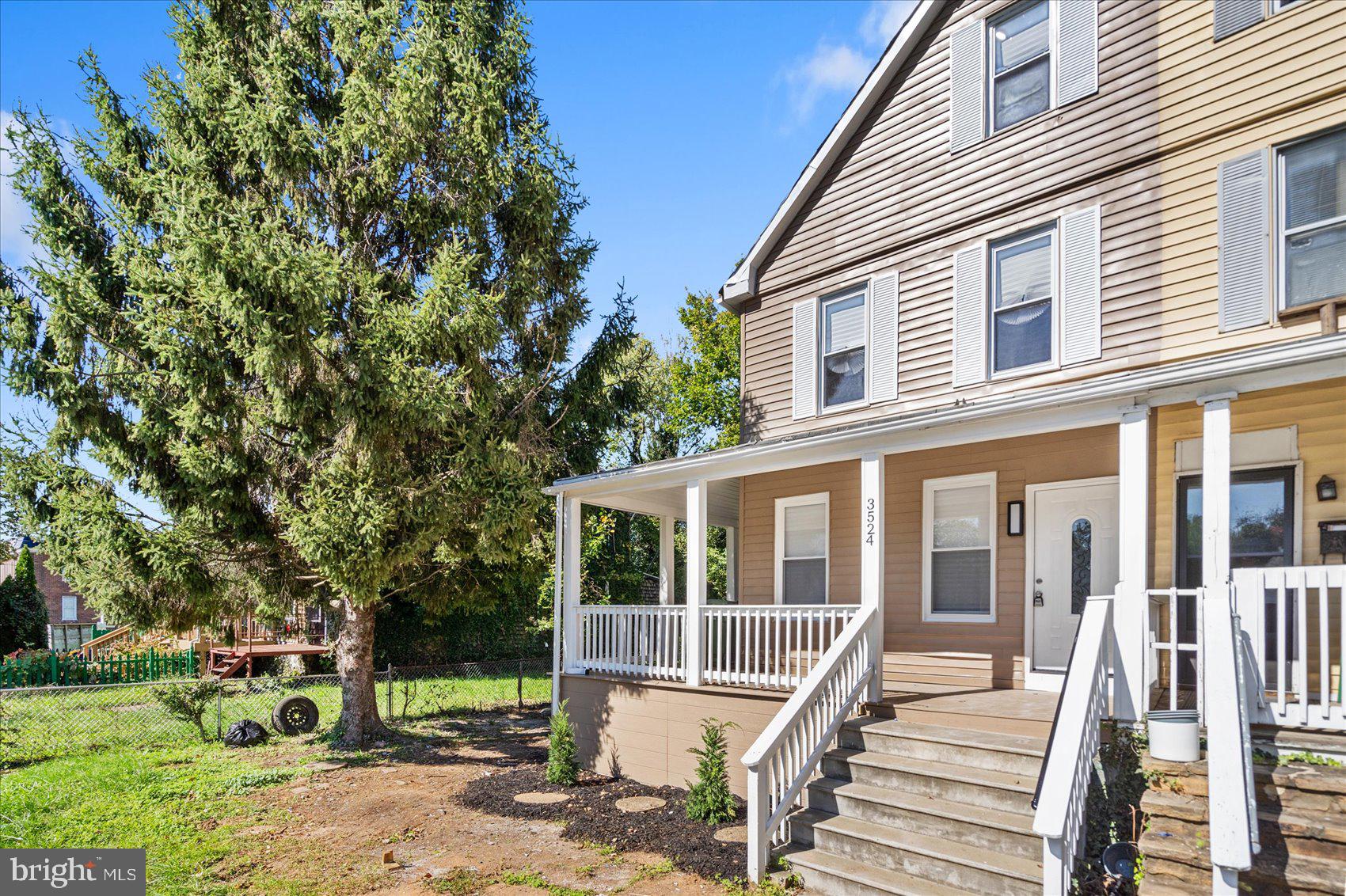 front view of a house with a yard