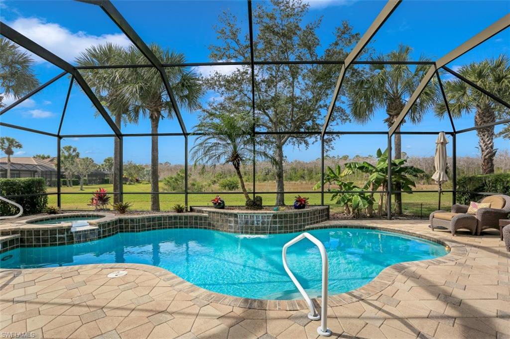 a view of a swimming pool with a lounge chairs