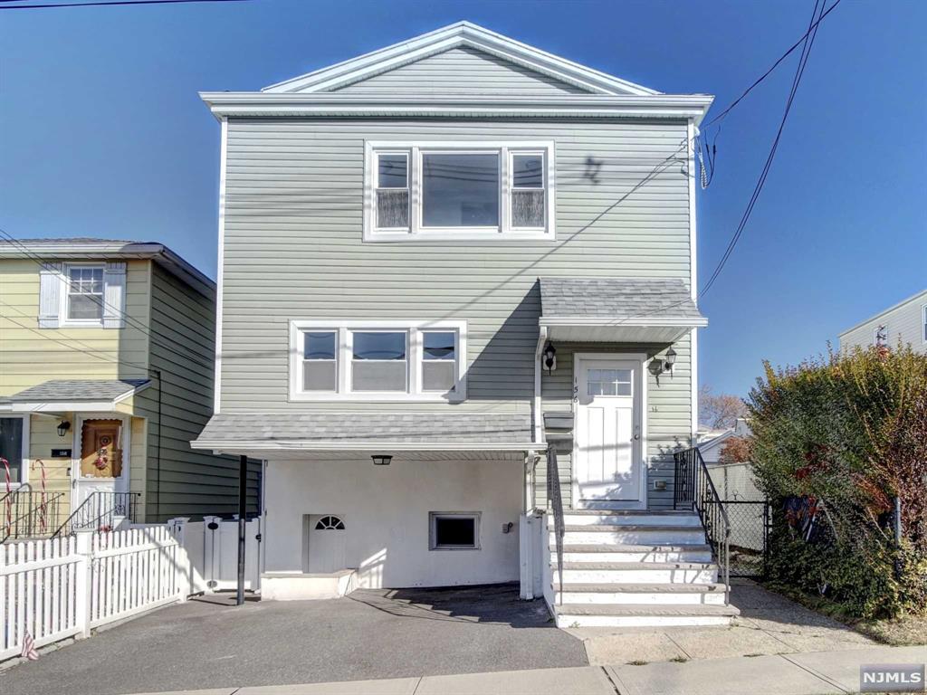 a front view of a house with a garage