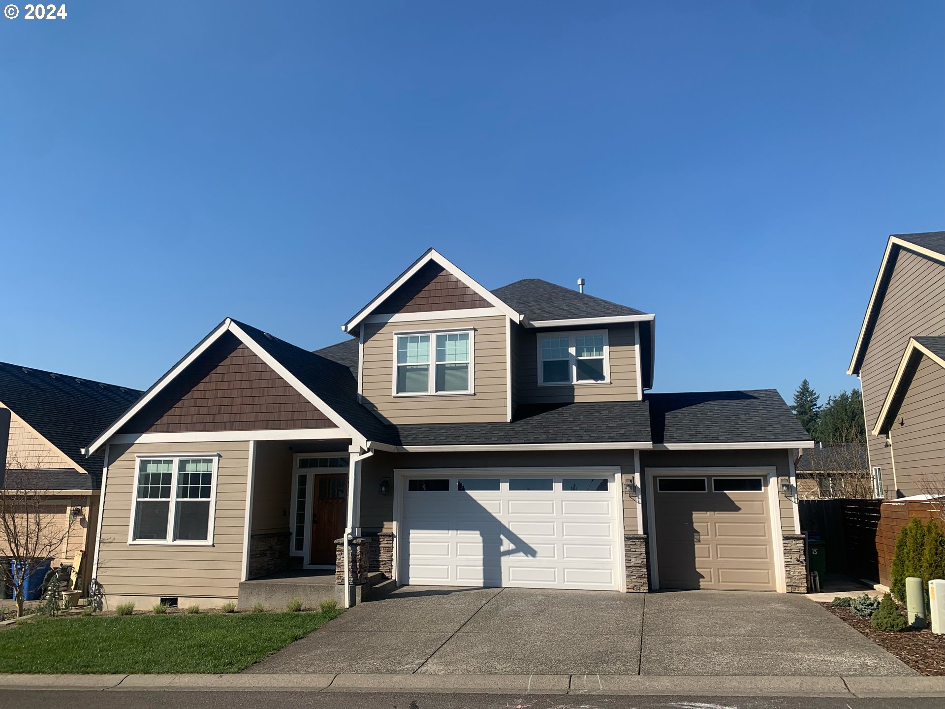 a front view of a house with garage