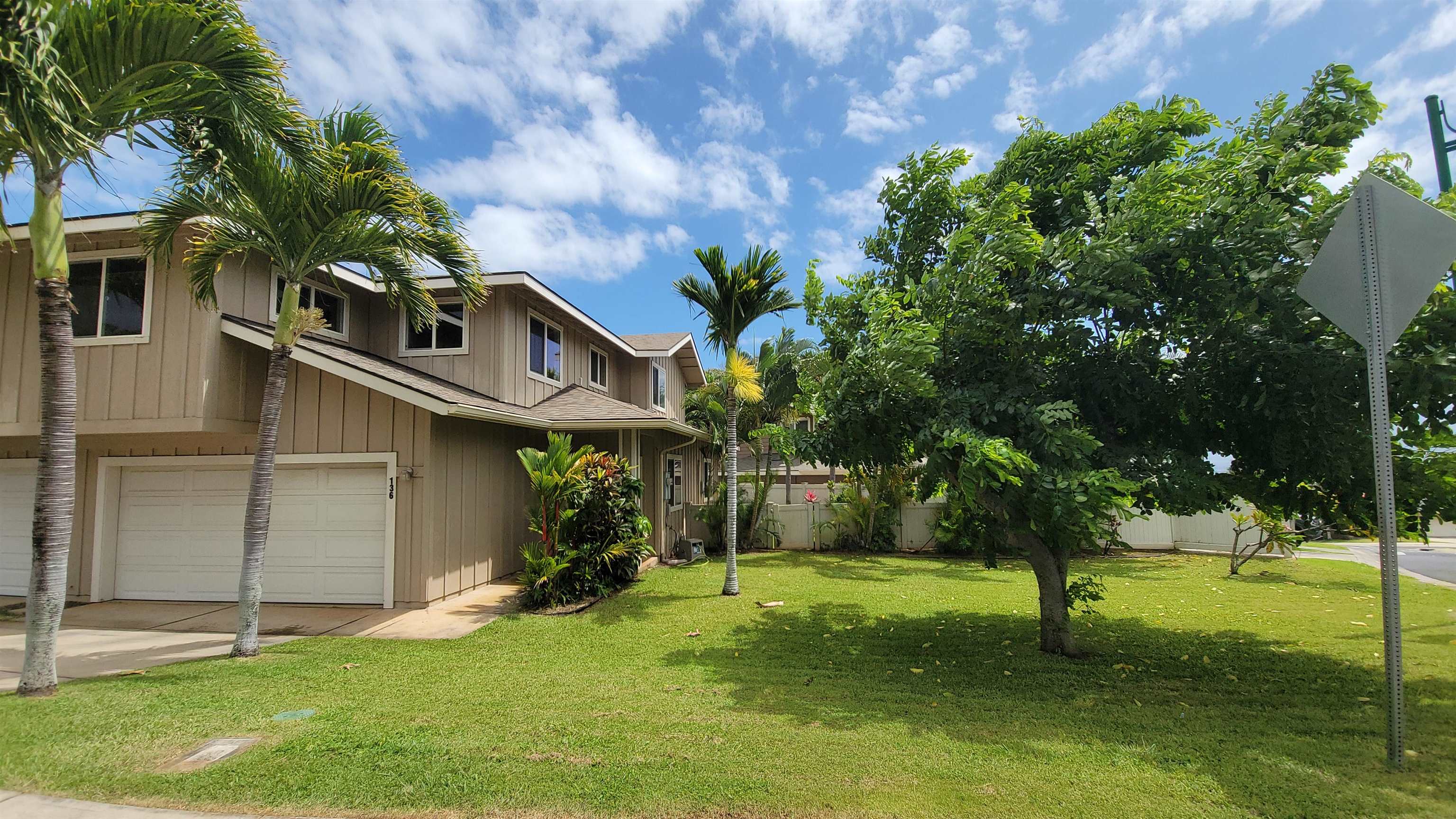 a view of a house with a backyard