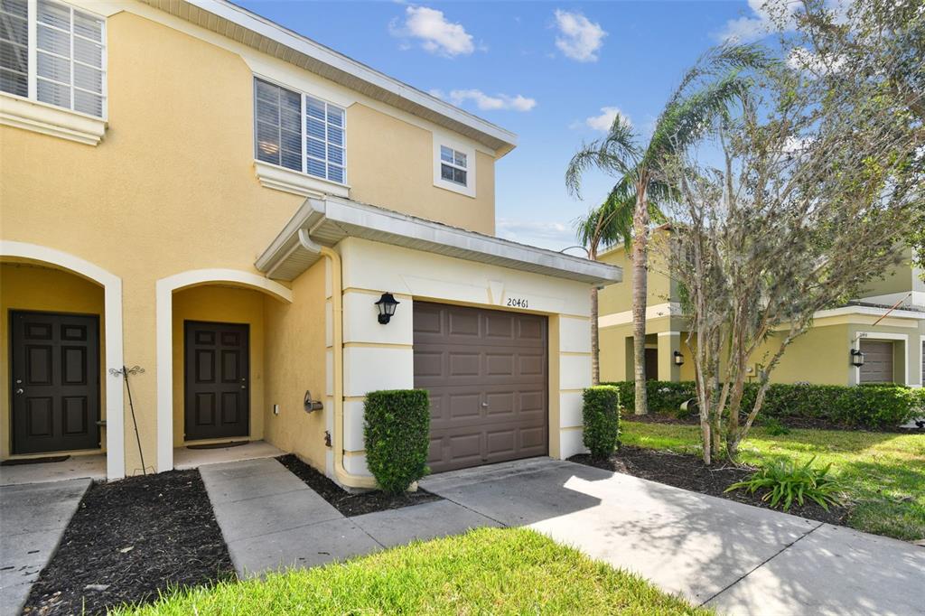 a front view of a house with a yard