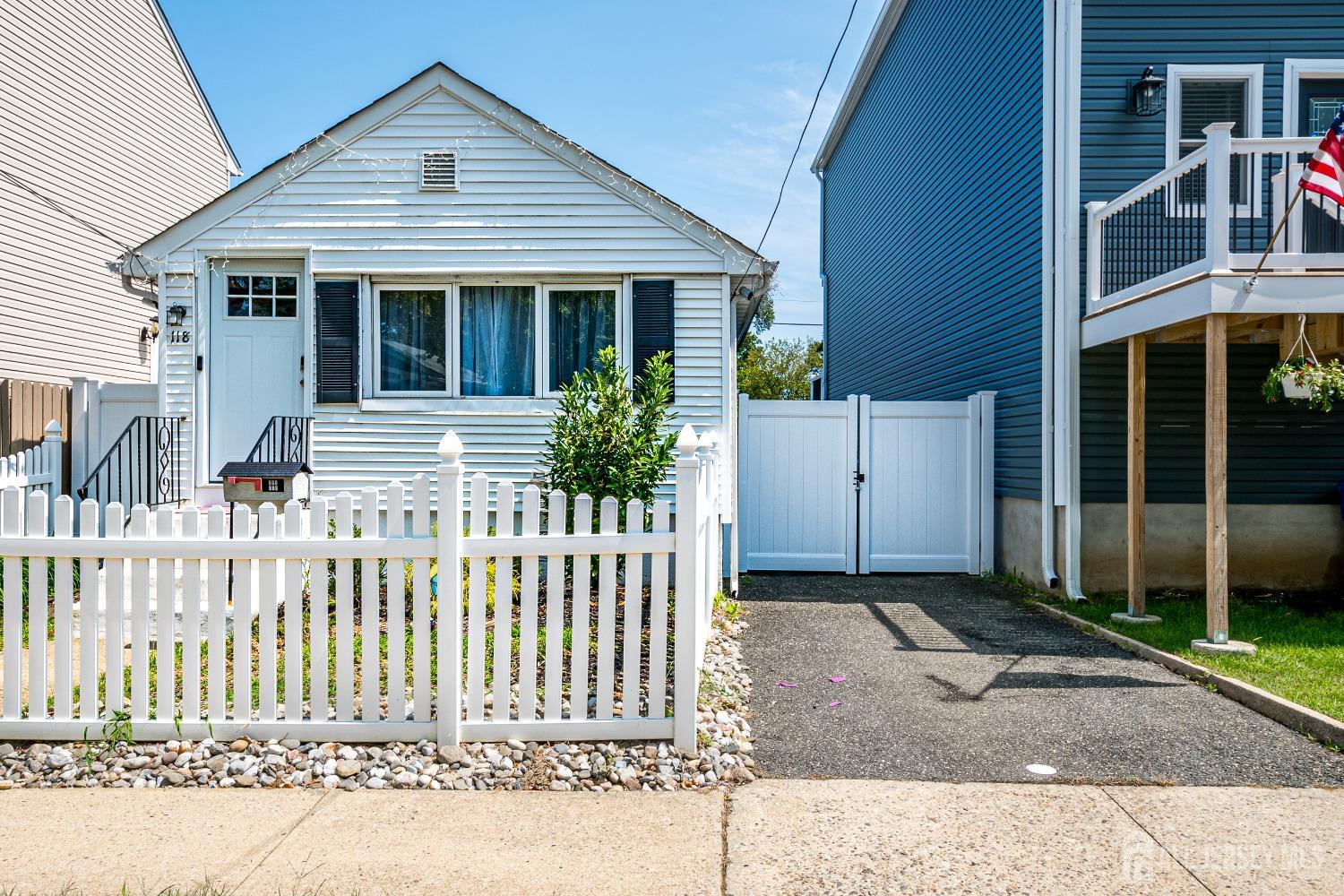 a front view of a house with a fence